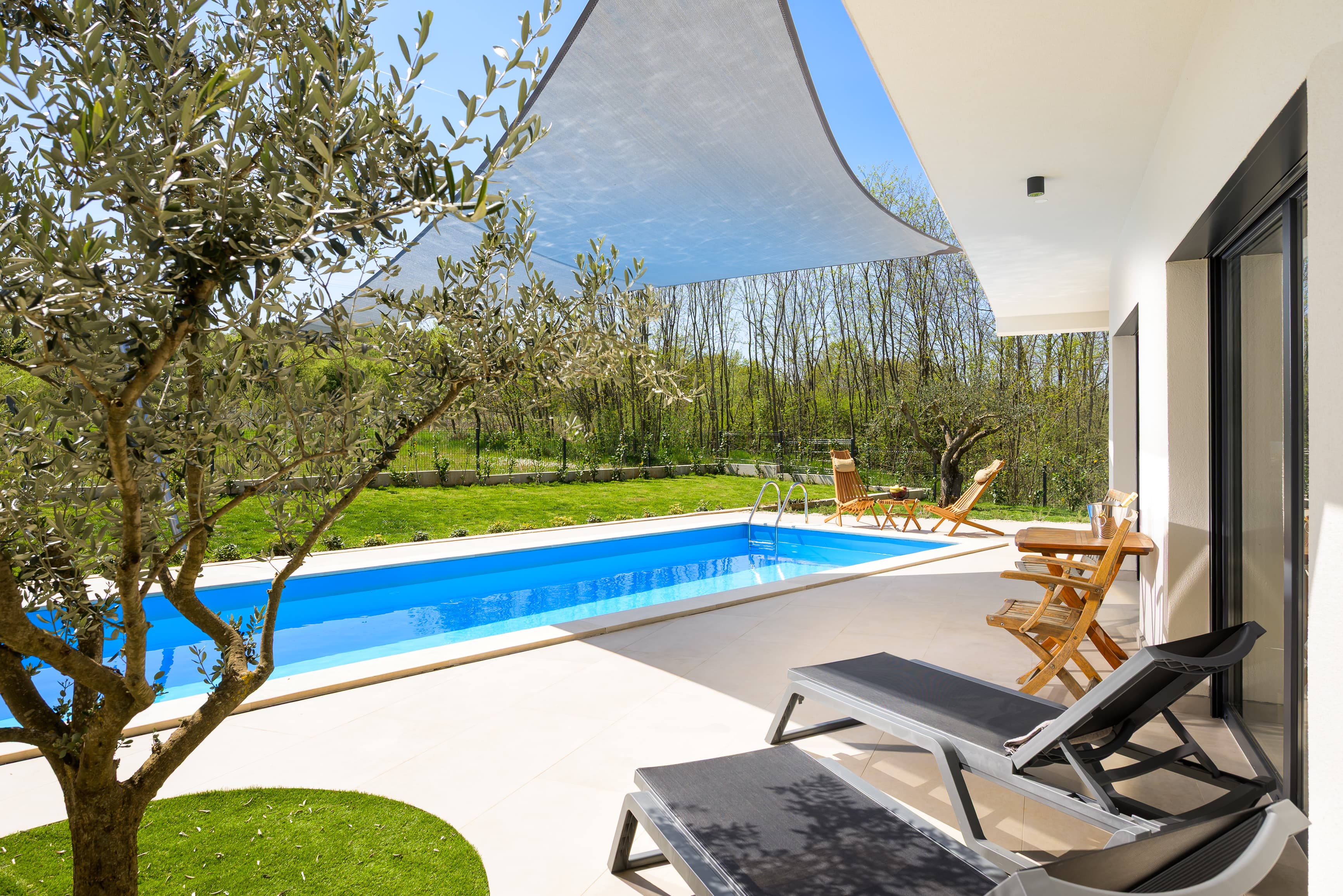 Daytime pool with shade sail